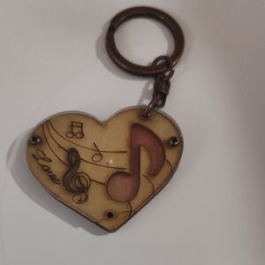 Heart-shaped laser-cut wood keychain featuring musical notes .Design Love 4 "